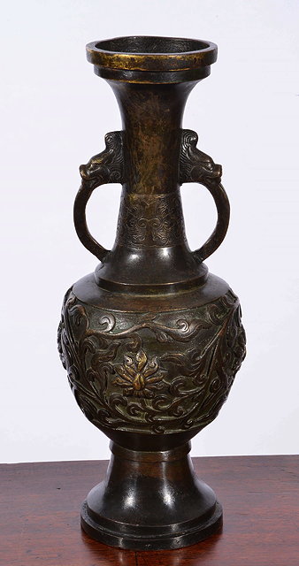 Appraisal: A TH CENTURY CHINESE BRONZE TWO HANDLED ALTAR VASE with