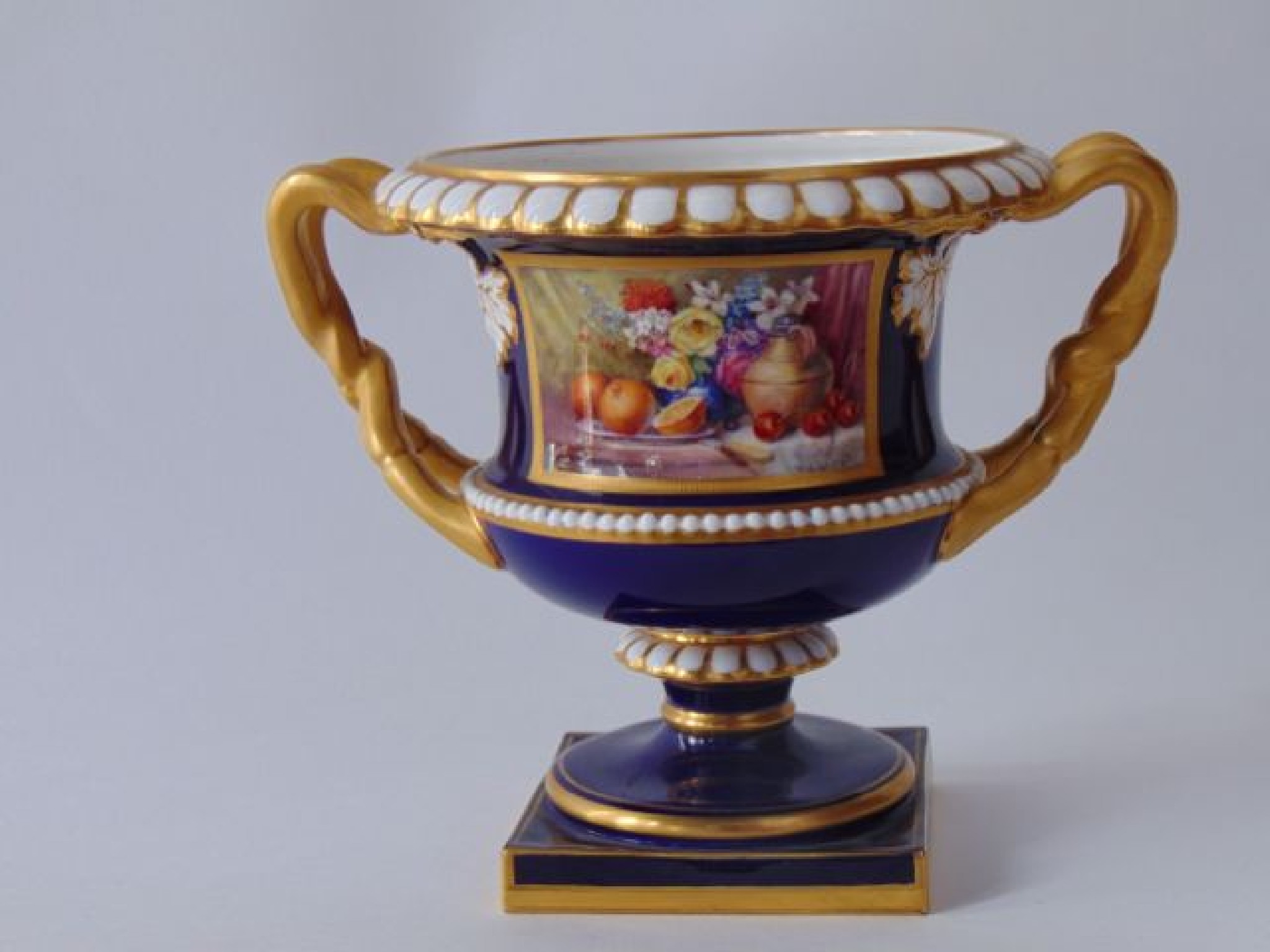 Appraisal: A Royal Worcester two handled urn shaped vase with finely