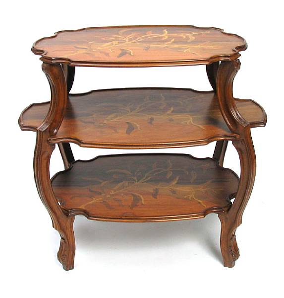 Appraisal: An Art Nouveau style three tier inlaid table in the