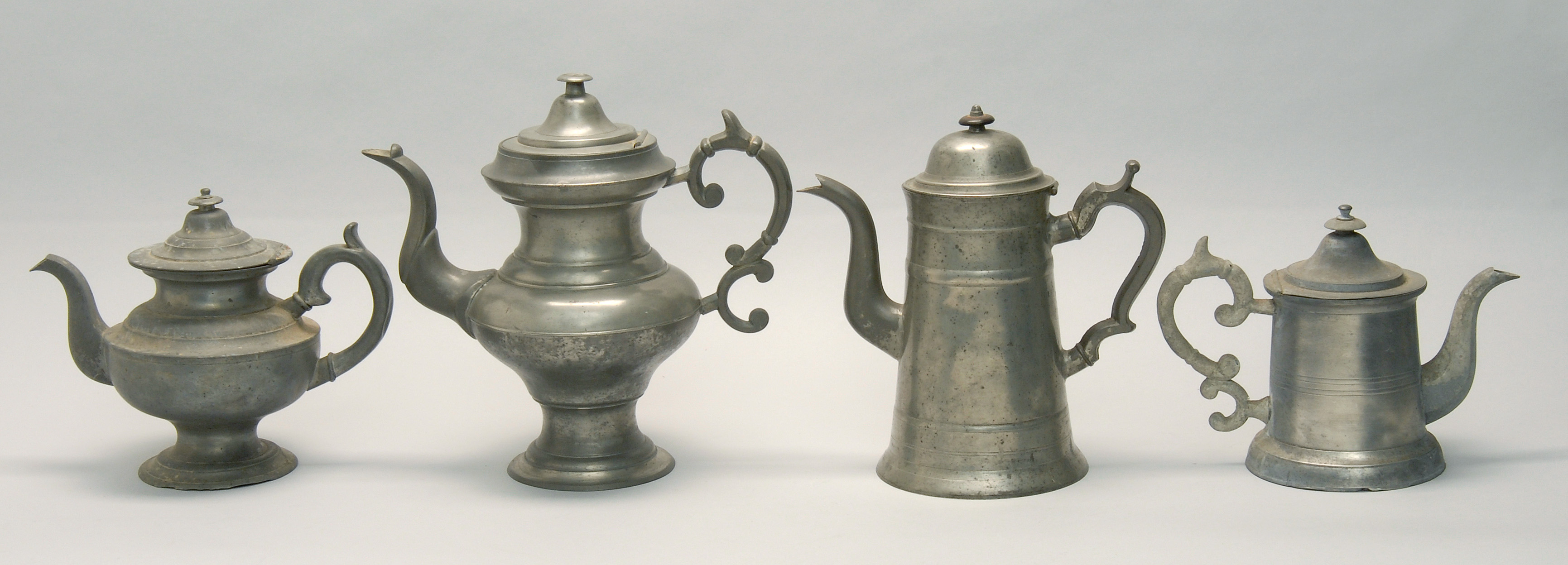 Appraisal: FOUR TH CENTURY AMERICAN COFFEEPOTS TEAPOTS a coffeepot by George