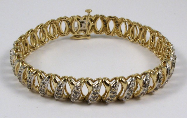 Appraisal: DIAMOND AND TEN KARAT GOLD BRACELET - in length and