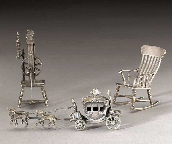 Appraisal: A group of two Dutch silver miniatures Comprising standard spinning