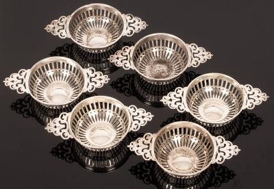 Appraisal: Six silver sweetmeat dishes William Comyns London quaich-shaped and with