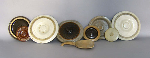 Appraisal: Eight stoneware crock lids together with a scoop and tin