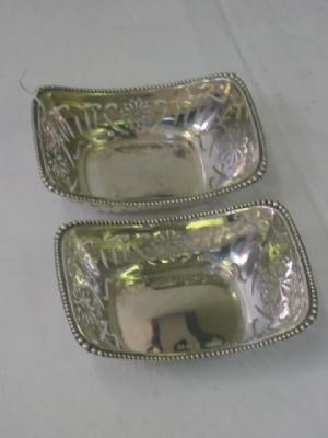 Appraisal: A PAIR OF BONBON DISHES of curved oblong form with