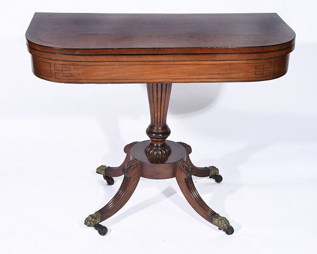 Appraisal: A REGENCY MAHOGANY D SHAPED TEA TABLE with ebony lined