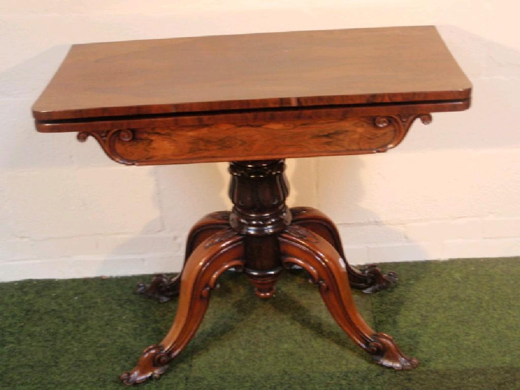 Appraisal: A Victorian rosewood card table with rectangular folding top and