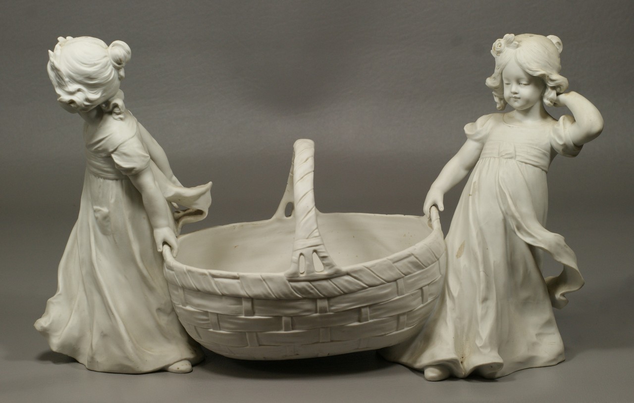 Appraisal: Parian porcelain planter flanked by young girls marked with the