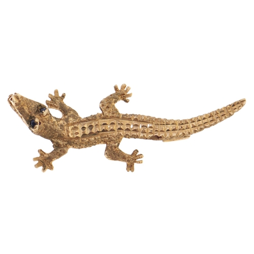 Appraisal: A gold alligator brooch with sapphire eyes g More Information