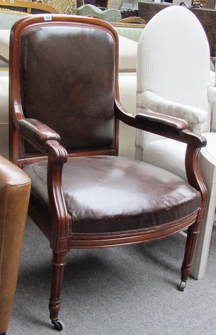 Appraisal: A Louis XVI style mahogany framed semi padded open armchair