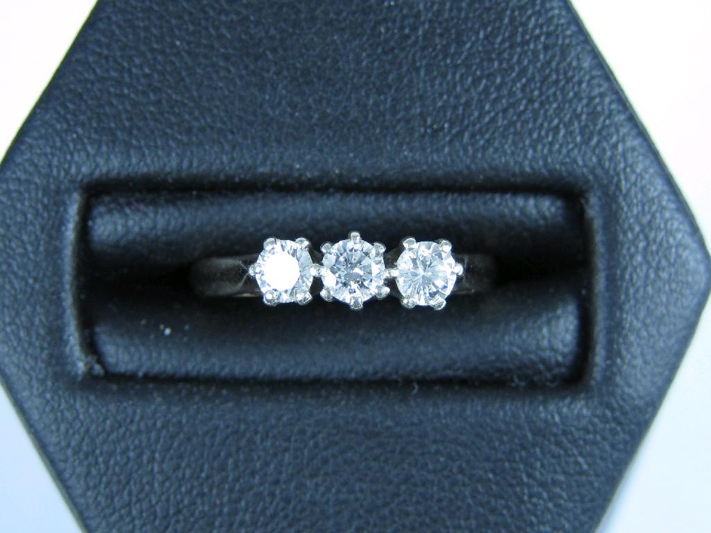 Appraisal: A Diamond three stone Ring the brilliant-cut stones claw-set in