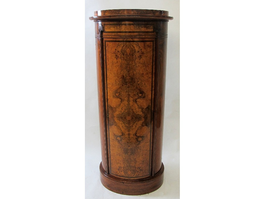 Appraisal: A Victorian burr walnut cylinder shaped cabinet the raised top