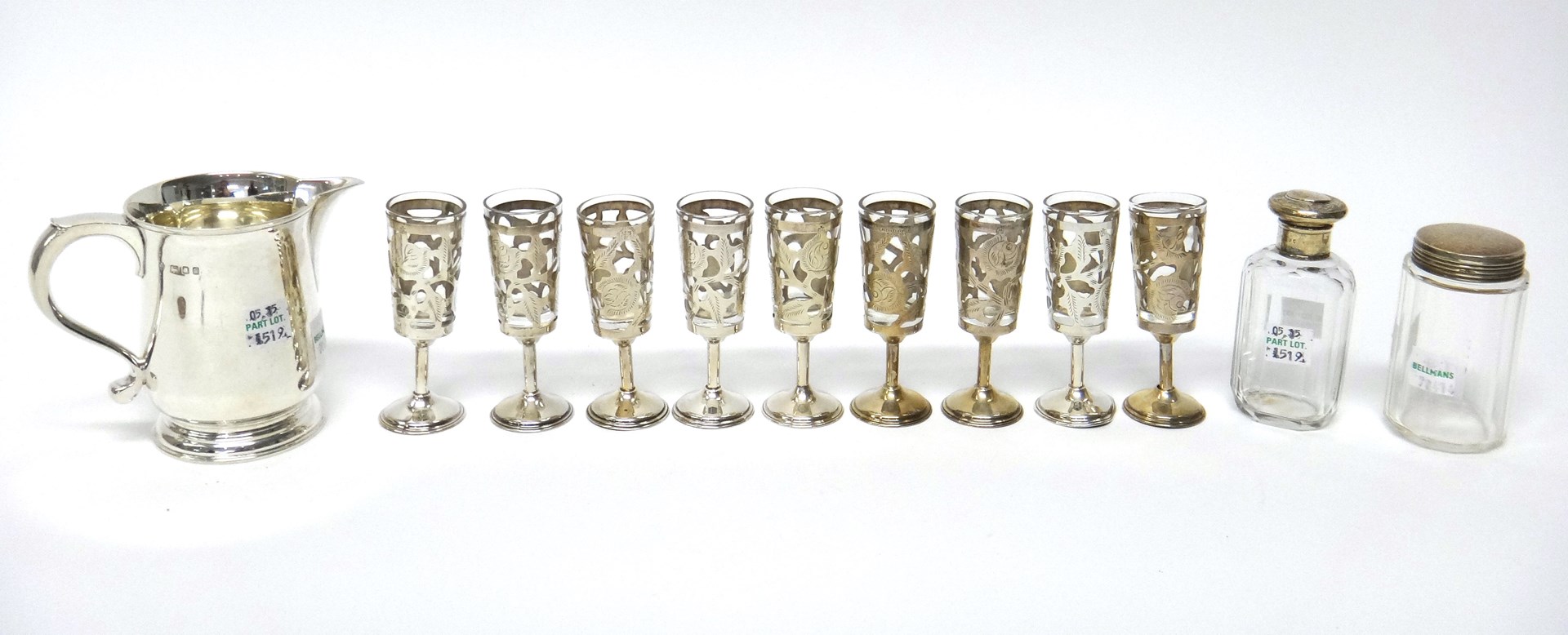 Appraisal: A set of nine Mexican Sterling mounted liqueur tots a