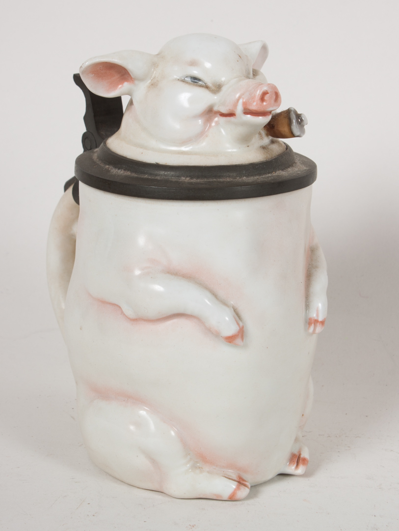 Appraisal: Musterchutz porcelain smoking pig stein late th century pewter-mounted stein