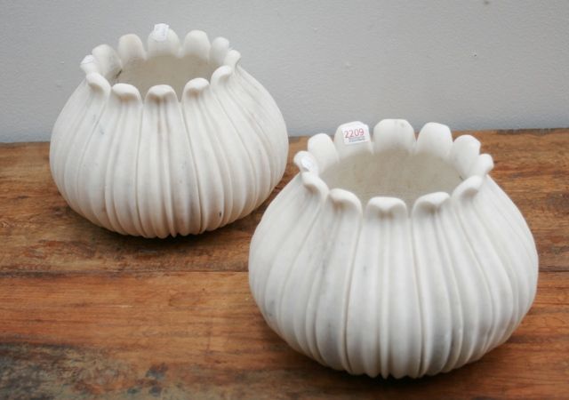 Appraisal: A pair of hand carved fluted white marble pots contemporary