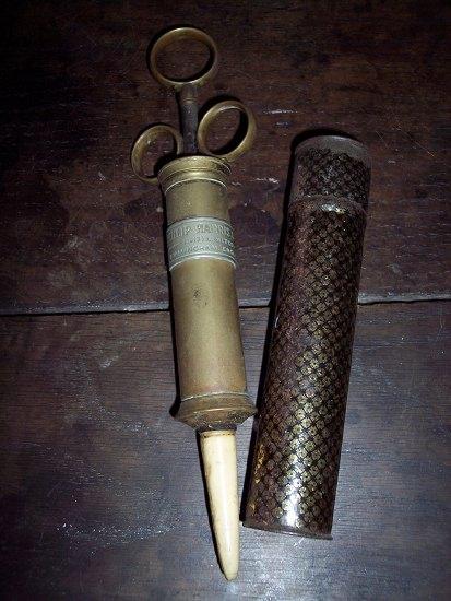 Appraisal: A brass cased icing syringe by Philip Harris Co and