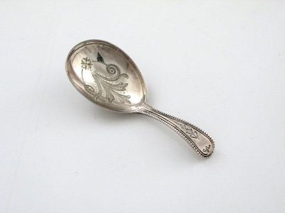 Appraisal: A Victorian caddy spoon pear-shaped bowl bright engraved decoration bead