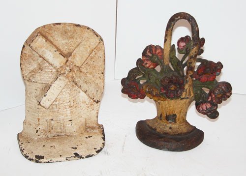 Appraisal: Artist unknown Title Cast Iron Doorstops a flower basket b