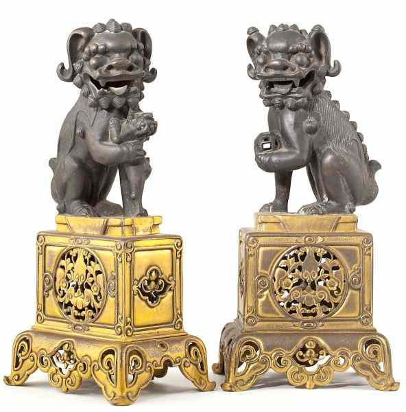 Appraisal: Pair of Chinese Bronze Foo Dog StatuesQianlong style circa male