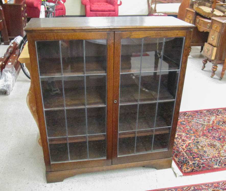 Appraisal: AN OAK CABINET BOOKCASE Herbet E Gibbs Furniture Co Edmonton