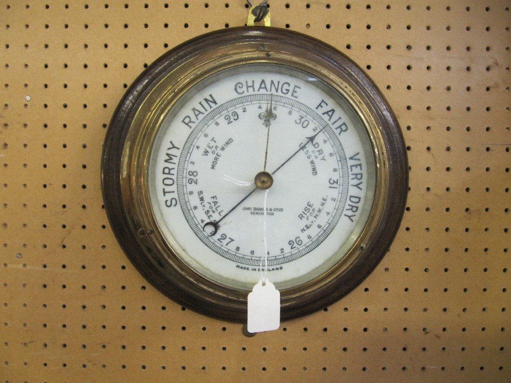 Appraisal: Oak and brass bound circular wall barometer