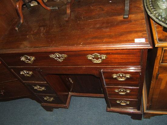 Appraisal: A George III mahogany kneehole desk with single long drawer