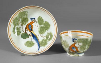 Appraisal: Spatterware cup and saucer peafowl and green-sponged background - in