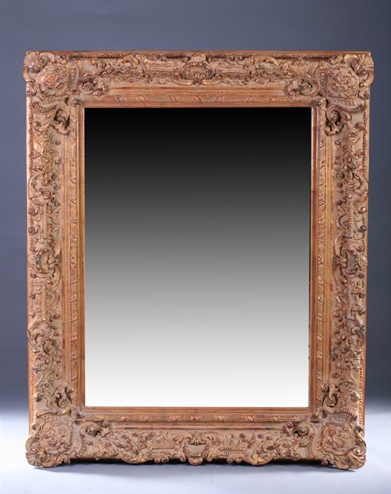 Appraisal: ROCOCO REVIVAL STYLE GILT-PAINTED WALL MIRROR th century Monumentaly scaled