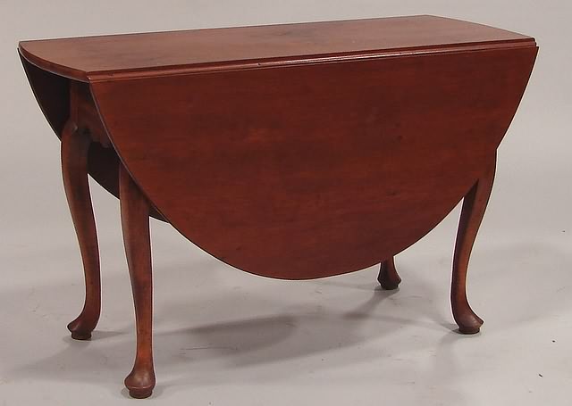 Appraisal: Cherry with pad foot cabriole leg and scalloped frieze demilune