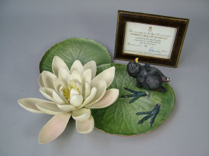 Appraisal: A Royal Worcester porcelain moor hen chick and water lily