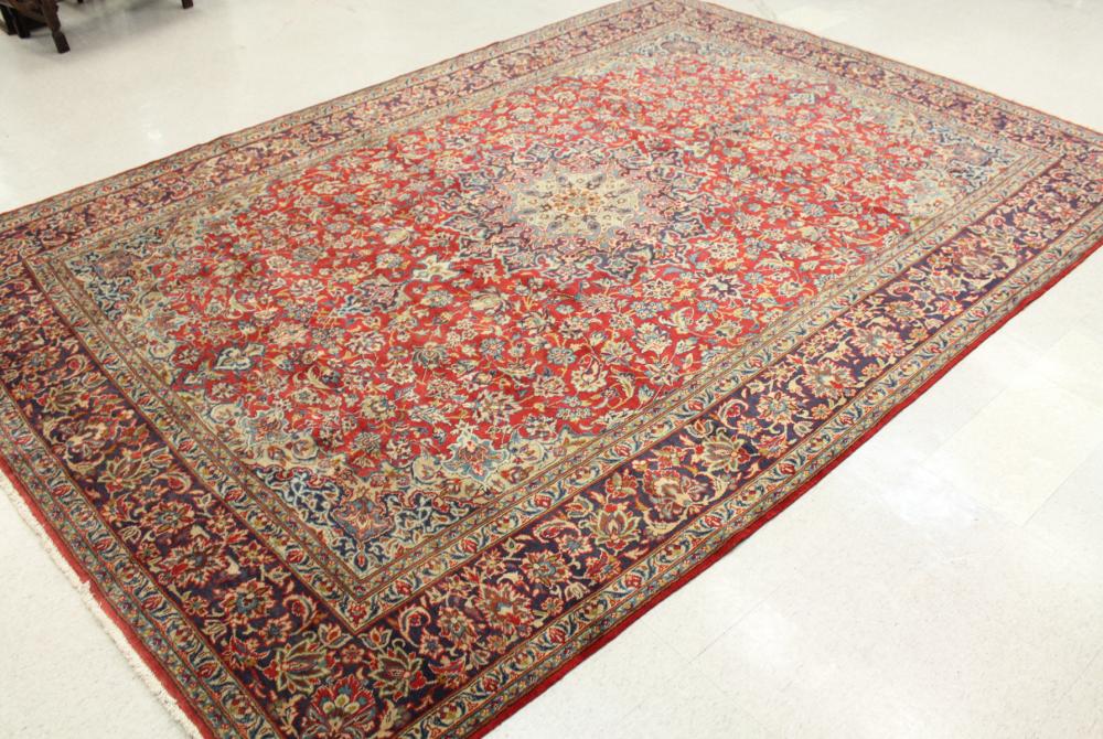 Appraisal: HAND KNOTTED PERSIAN CARPET floral and central floral medallion design