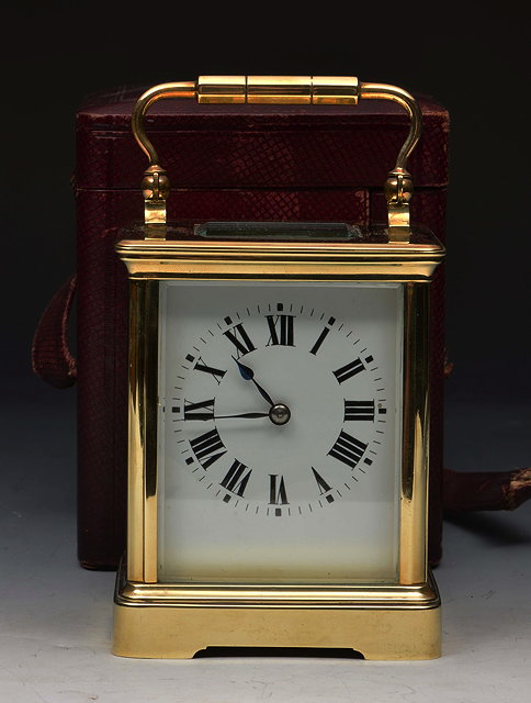 Appraisal: A FRENCH BRASS CARRIAGE TIMEPIECE the white enamel dial with