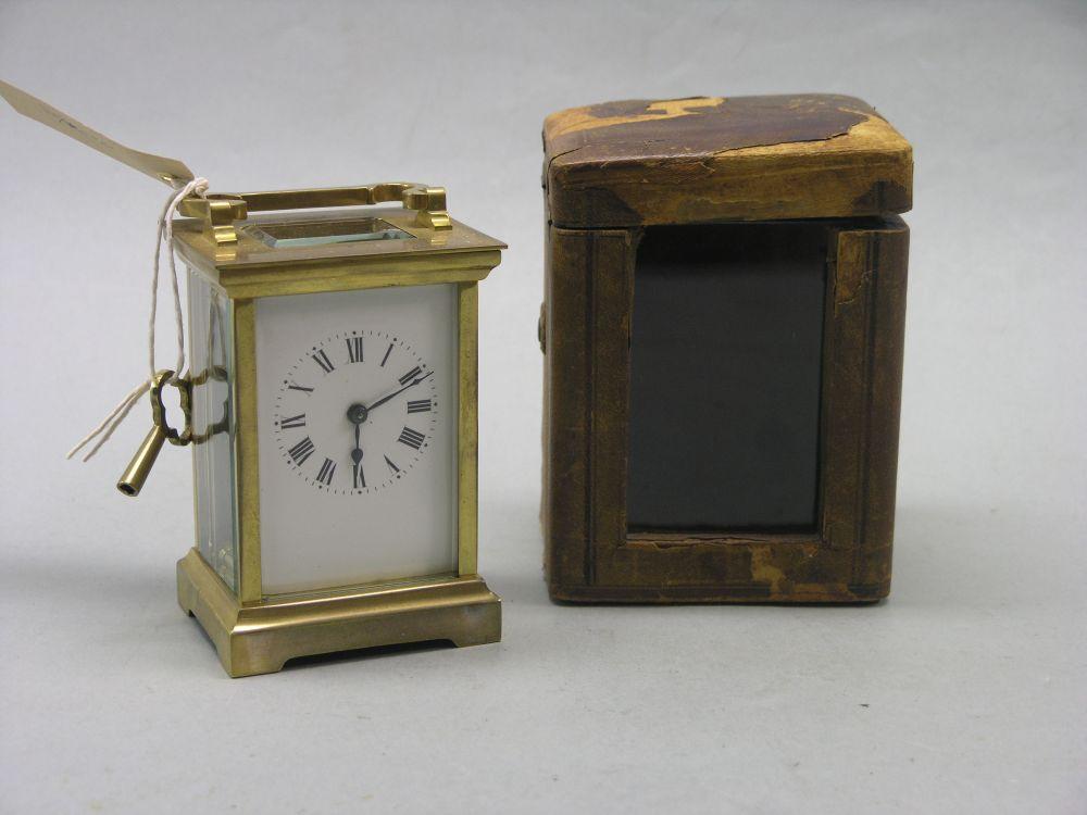 Appraisal: A brass carriage clock enamelled dial timepiece movement portable in