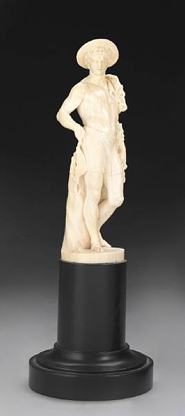 Appraisal: A French carved ivory figure of a fisherman late th