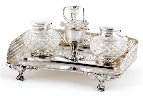 Appraisal: Continental silverplate inkwell urn-form central compartment with candleholder top flanked