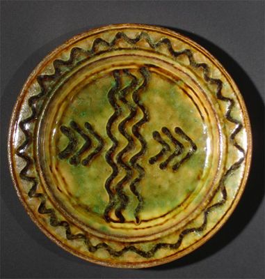 Appraisal: An early Michael Cardew Winchcombe Pottery plate trailed slip decoration