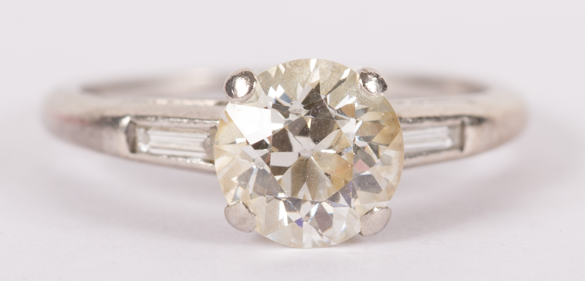 Appraisal: A ct Round Diamond Ring with Baguettes diamond ring approximately