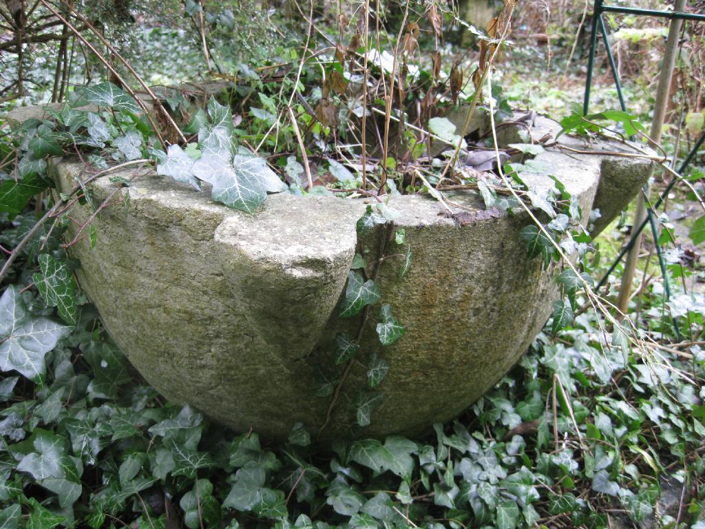 Appraisal: A very large circular stone Mortar with four protruding lugs