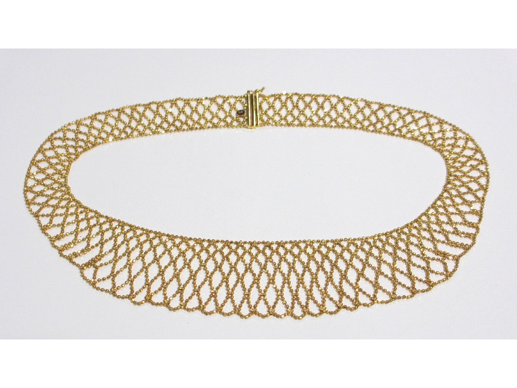 Appraisal: A nine carat gold openwork collar with linked micro beads