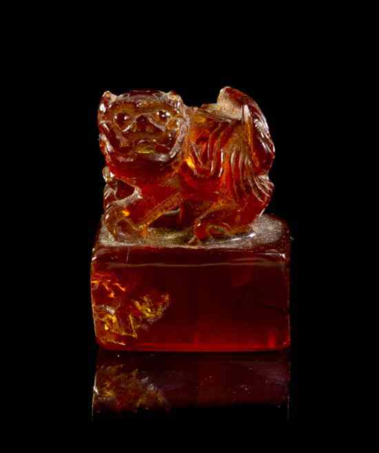 Appraisal: A Chinese Carved Amber Seal Stamp of squared form surmounted