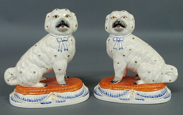 Appraisal: Rare pair of Staffordshire seated Maltese dogs on oval cushions