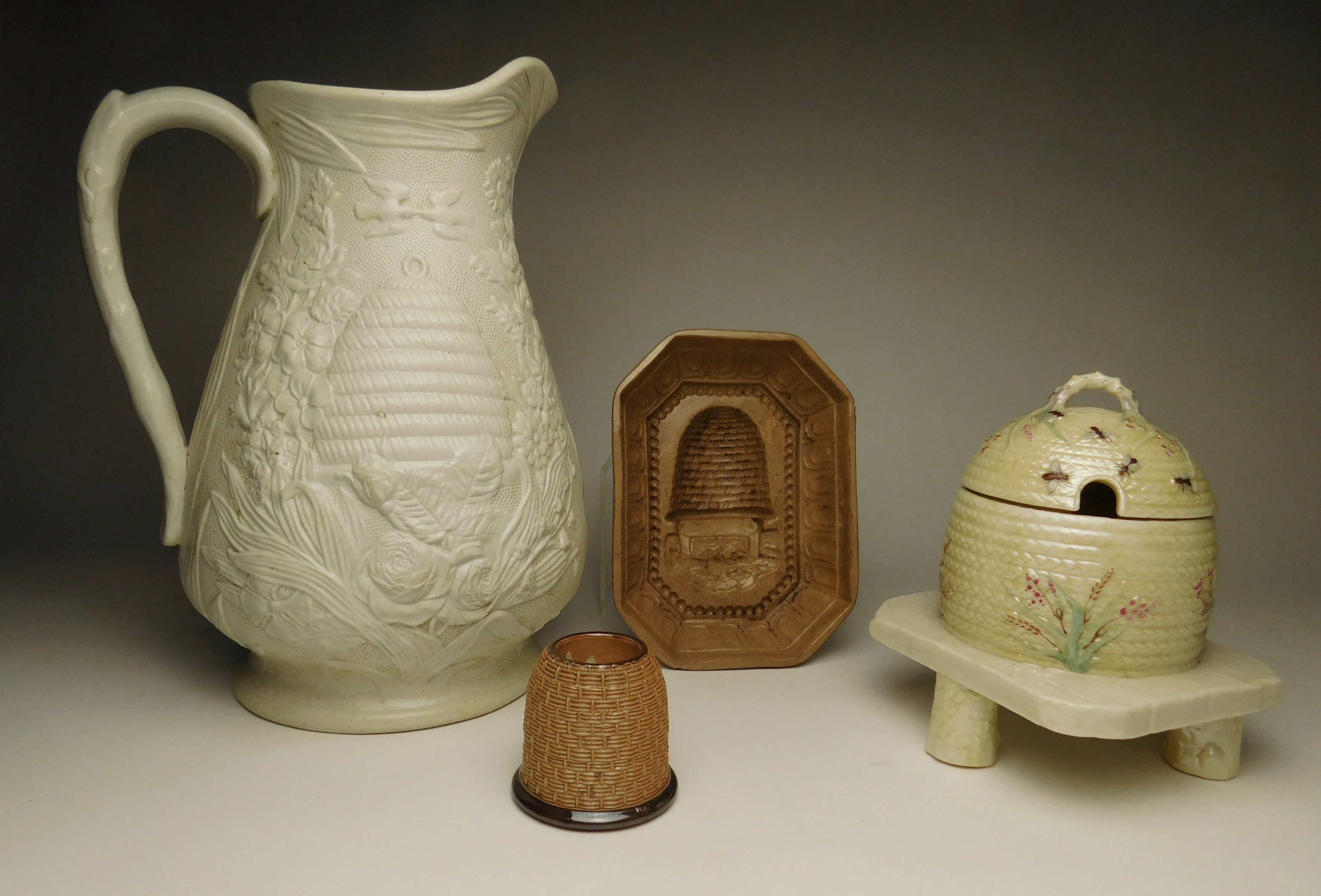 Appraisal: Pottery 'Bee' motif items- Parian salt glaze pitcher ''h Majolica