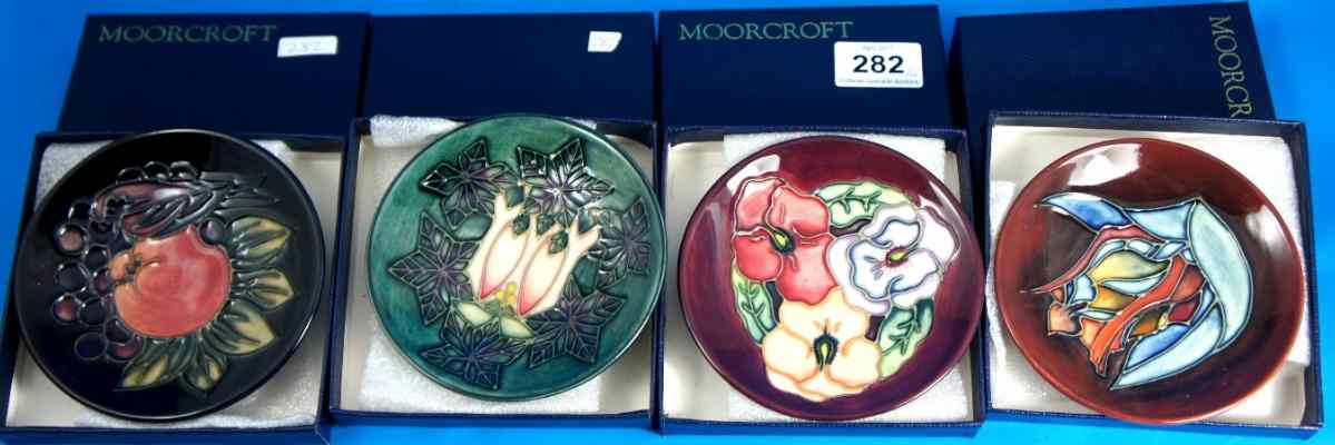 Appraisal: Moorcroft Dishes decorated in various floral and landscape designs boxed