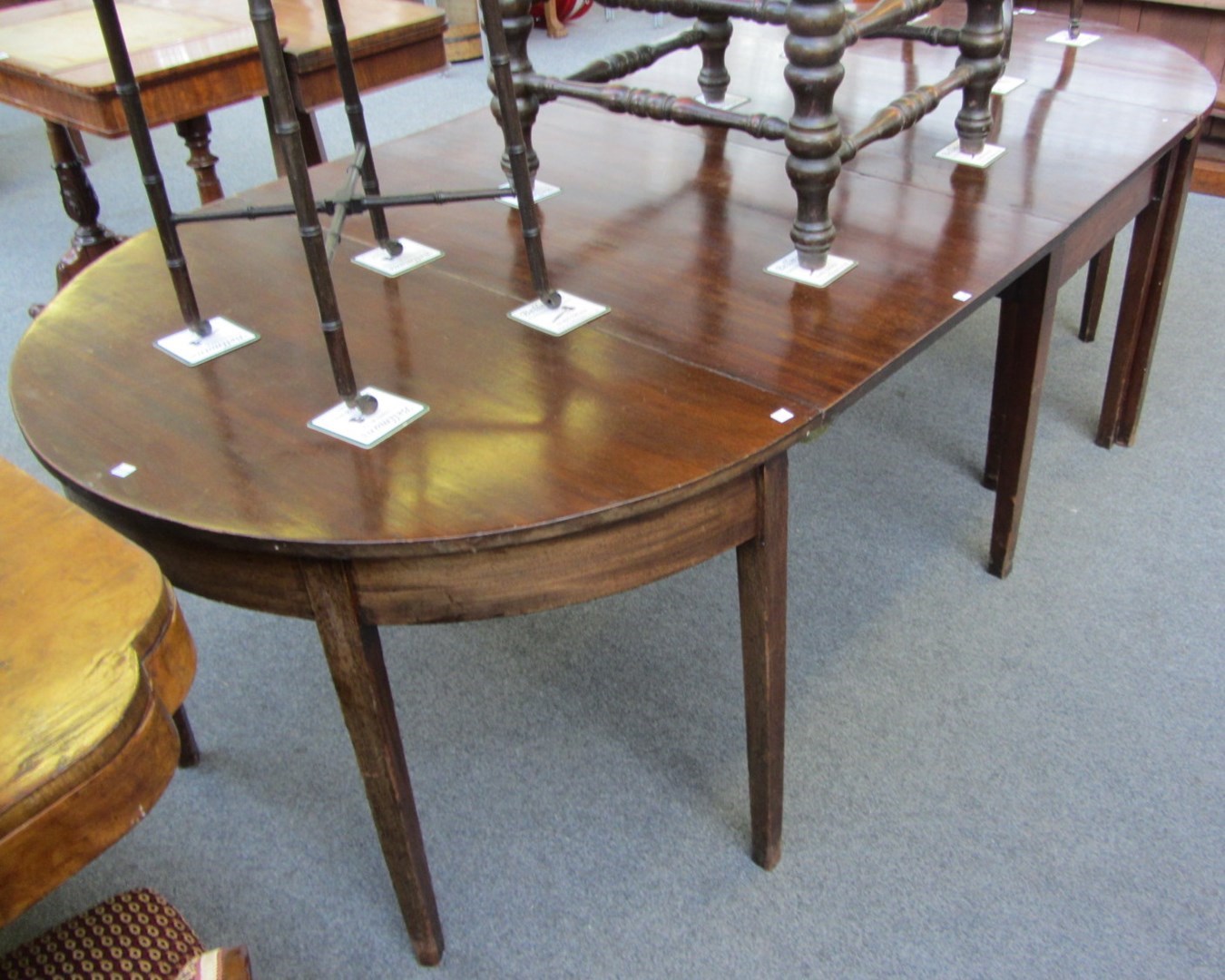 Appraisal: A George III mahogany 'D' end extending dining table with