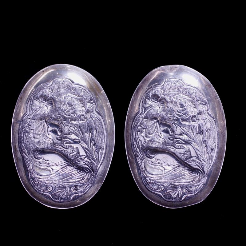 Appraisal: Pair silver Art Nouveau trays with maiden figures in relief