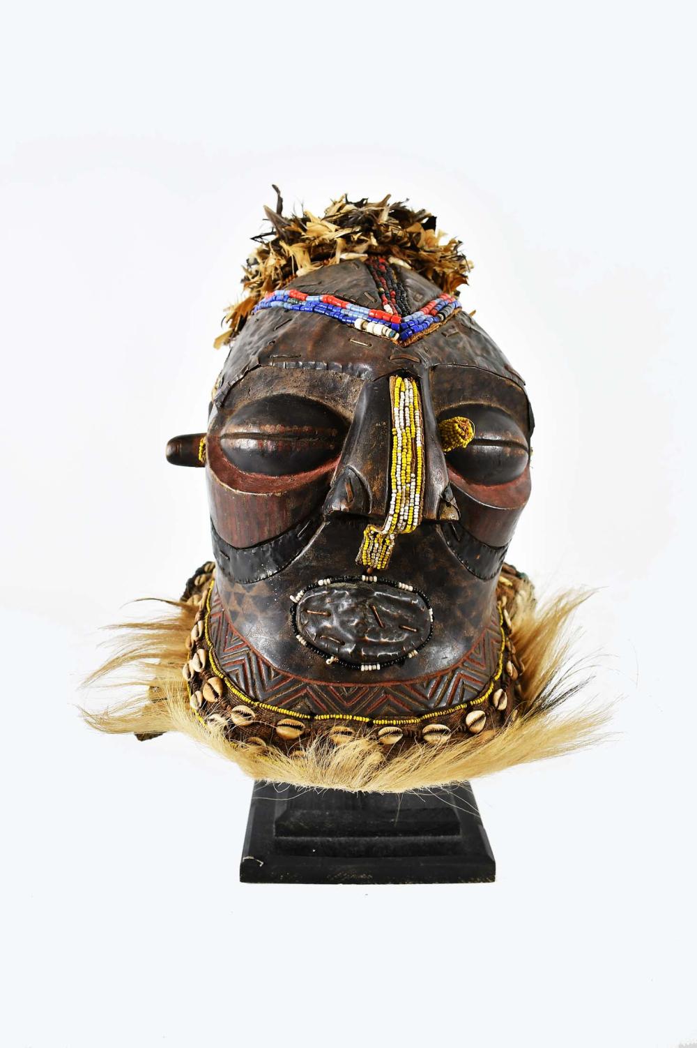 Appraisal: KUBA BEAD FEATHER COPPER MOUNTED WOOD HELMET MASKHuman features fitted