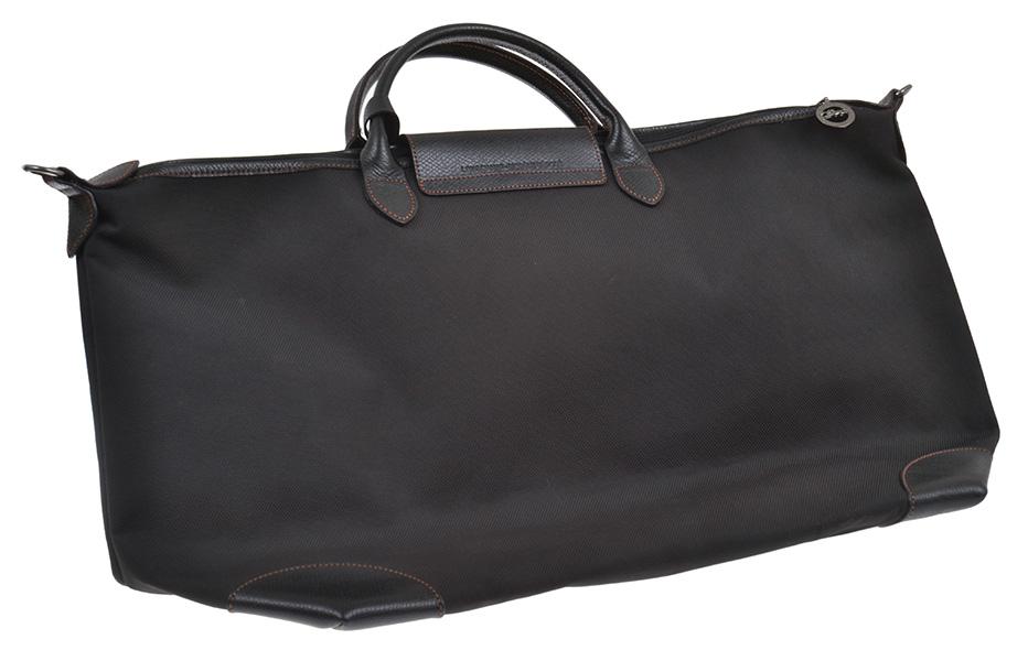 Appraisal: AN OVERNIGHT BAG BY LONGCHAMP Styled in black canvas with