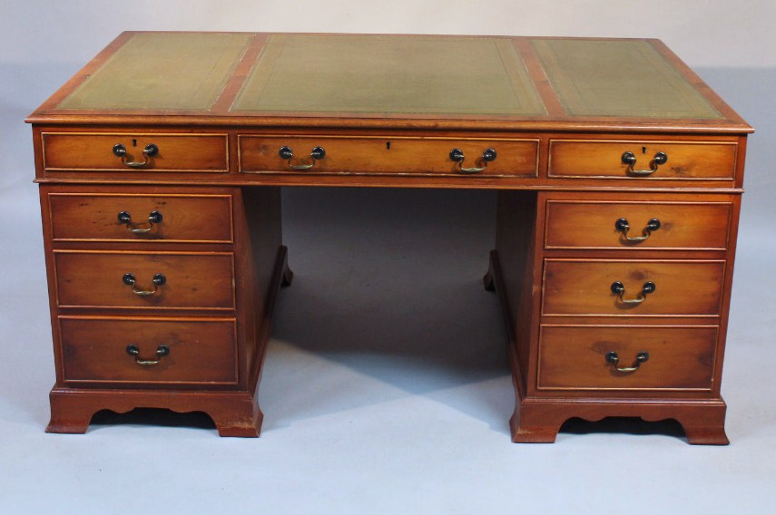 Appraisal: A thC yew wood finish pedestal desk the upper section