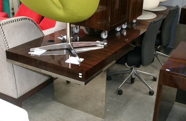 Appraisal: A walnut veneered and stainless steel desk cm long cm