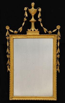 Appraisal: GEORGE III GILTWOOD MIRROR The rectangular carved frame centered by